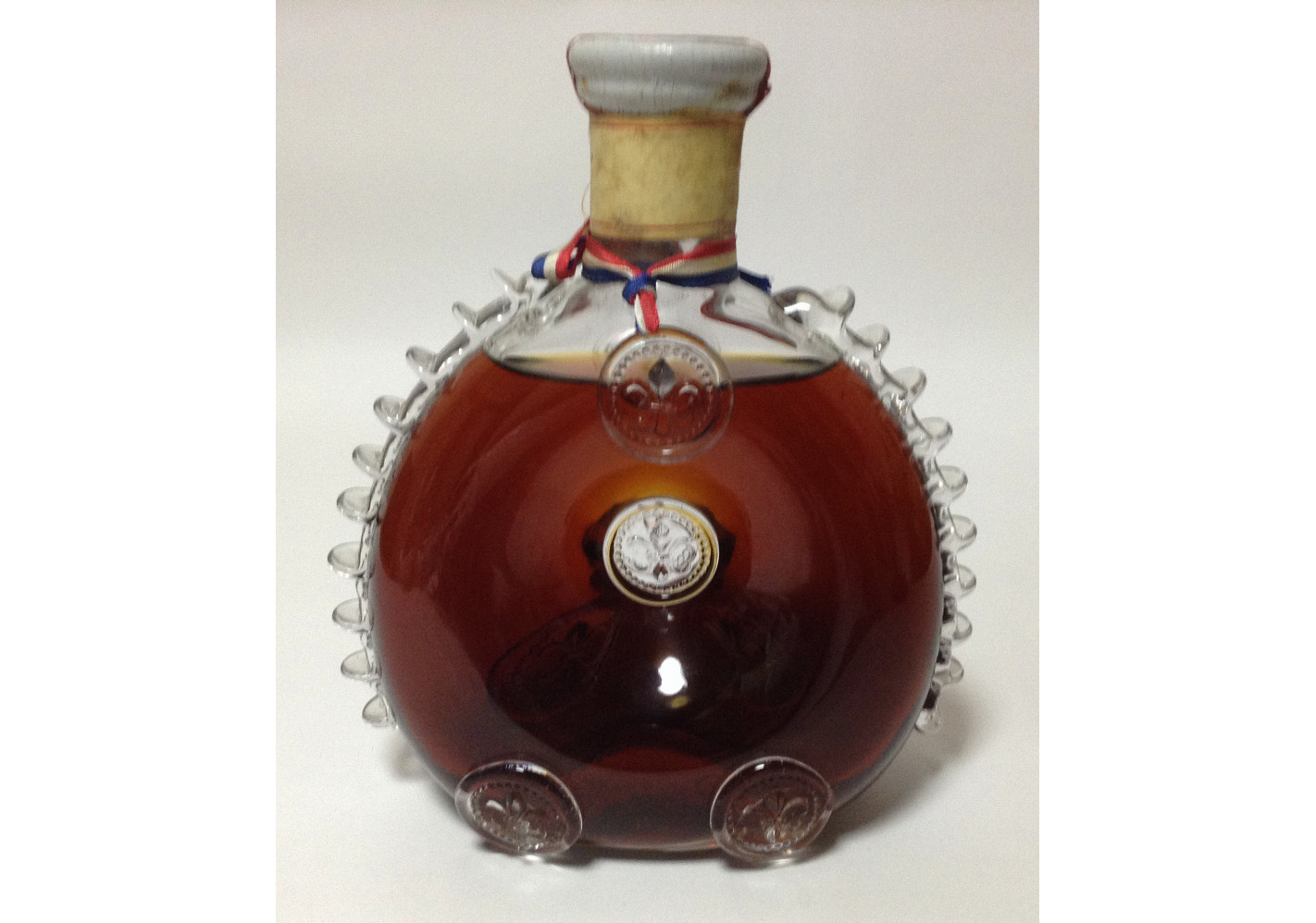 At Auction: An empty Louis XIII Remy Martin Grand Champagne Cognac bottle  (H:28cm)