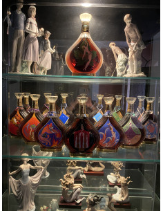 Entire collection of Erte Cognacs bottles 1-8.